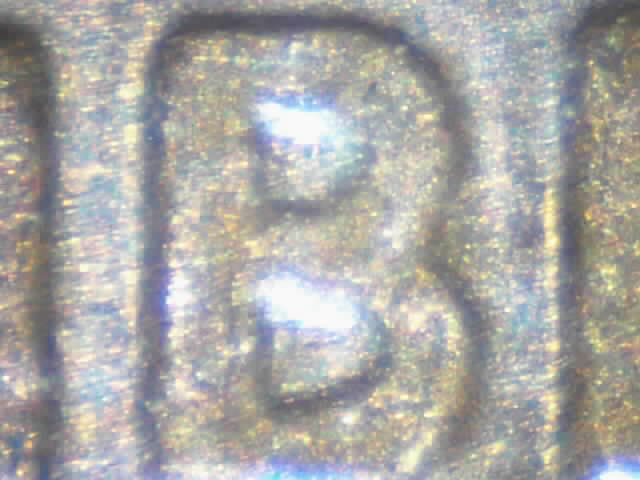 B is for Liberty?
The "B" from the word "Liberty", off of a 1992 penny.
