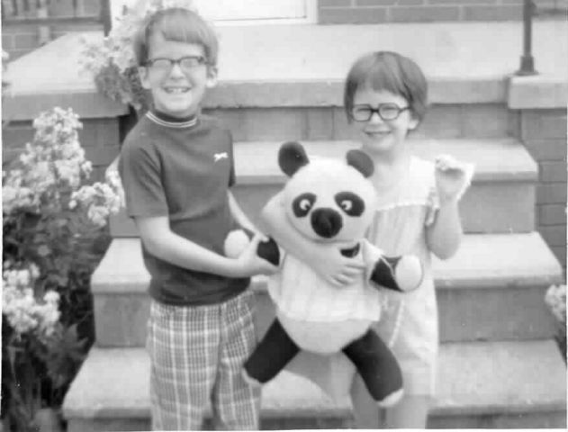 Thomas and Mary
Thomas and his sister, Mary, back in the day.  ACK!  Did Thomas *really* wear those hideous pants?  That panda belongs to Thomas's sister, who named him (her?), "Gladly, the cross-eyed bear."  
